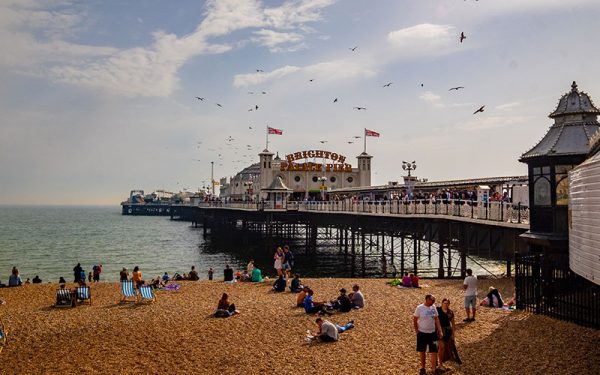 People sat at the beach in Brighton