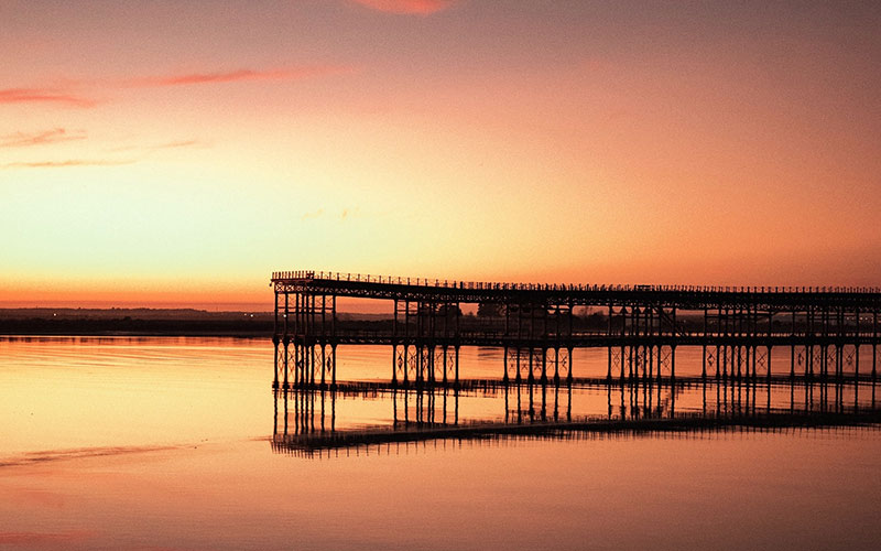 Sunset at a pier in Huelva
